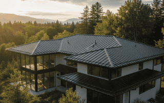 Modern black standing seam metal roof on a luxury home, showing 2026 exterior design trends.